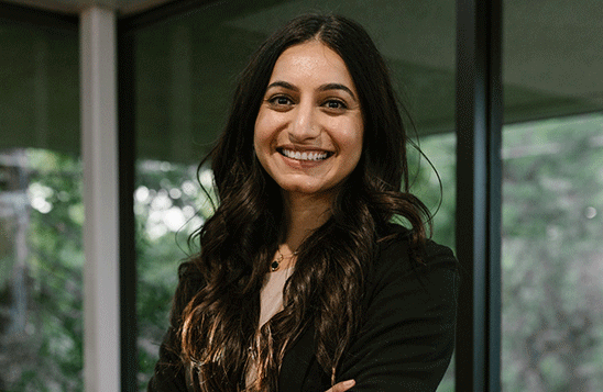 Professionally dressed woman smiling